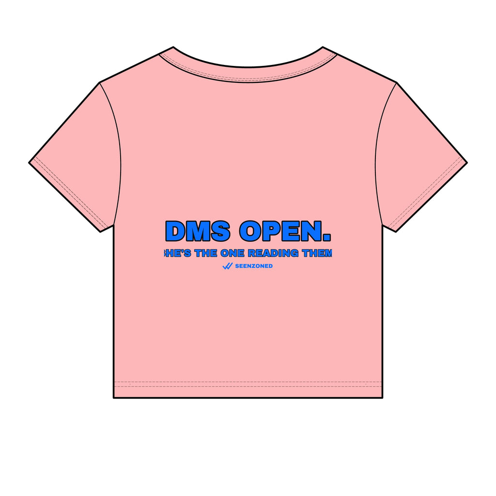 DMs open. She's the one reading them. Baby Tee