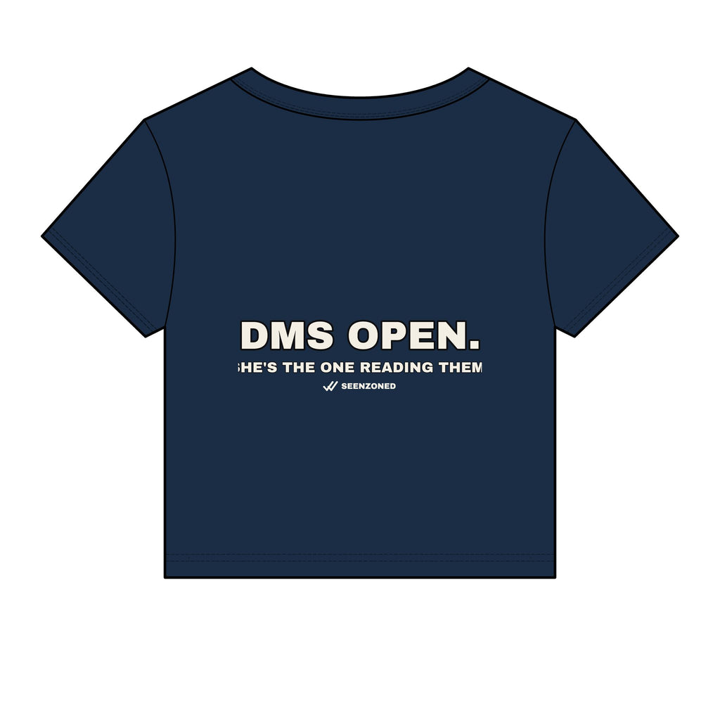 DMs open. She's the one reading them. Baby Tee